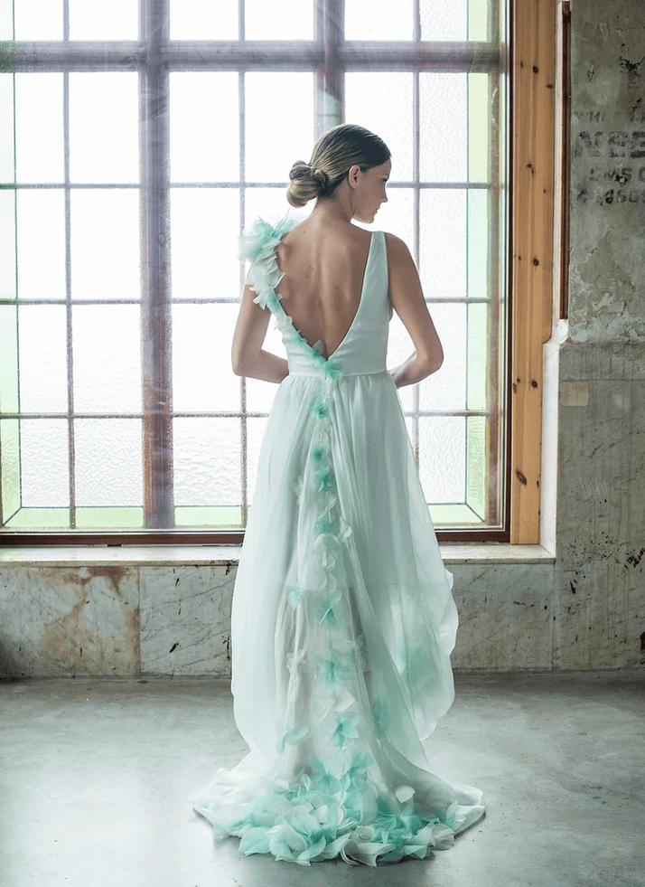 A Beaded Backless Wedding Dress and Pale Green Wedding Shoes for a