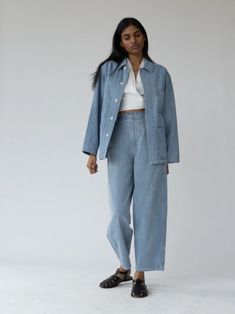 A model wearing a denim jacket and matching jeans from Shaina Mote.