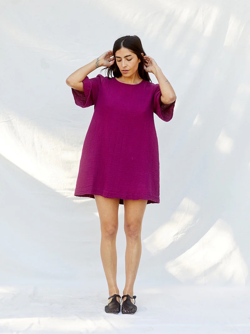 A model wears a short magenta quarter sleeve loose dress from Sugar Candy Mountain. 