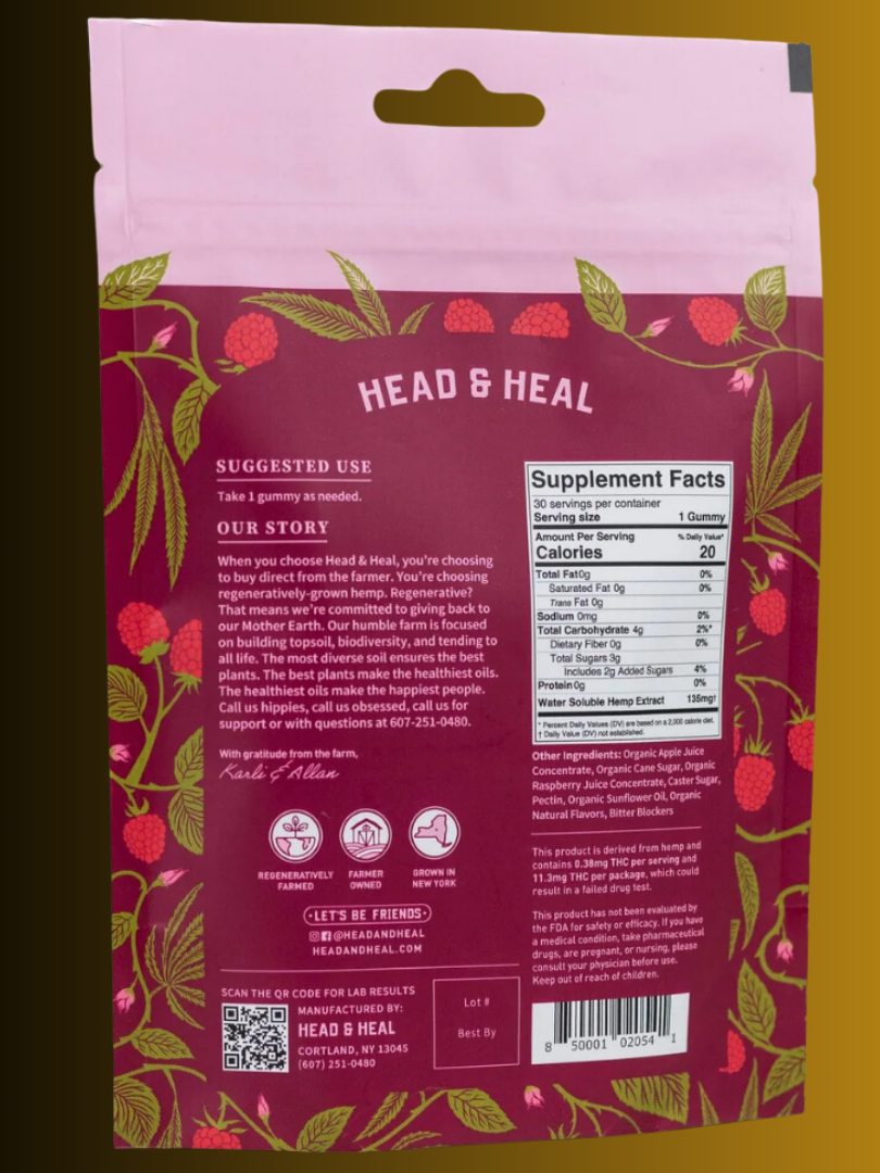 A photo of a raspberry-flavored supplement package from "head & heal" with usage instructions, ingredients, and a qr code on the back.