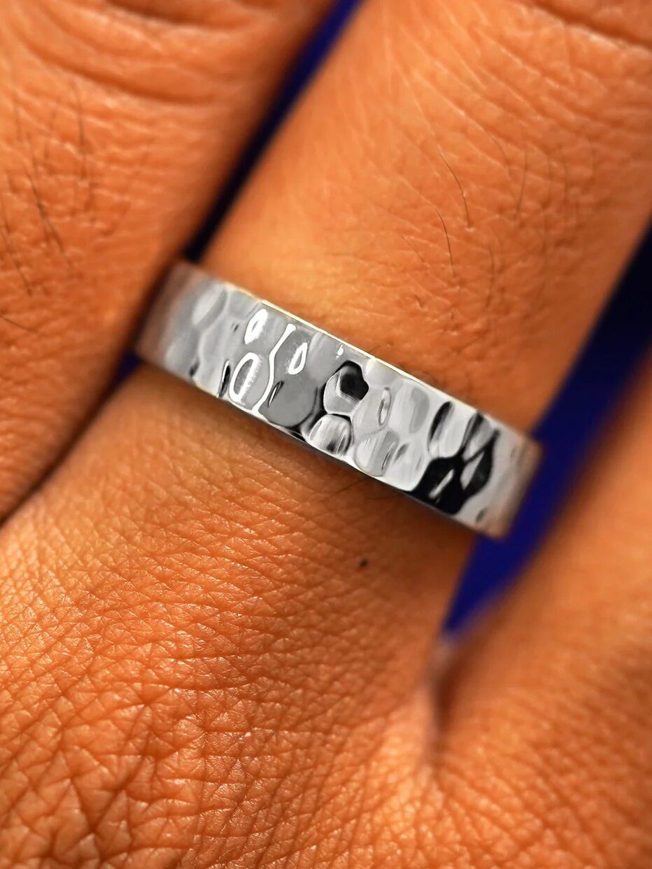 A hammered thick silver wedding band from Automic Gold.