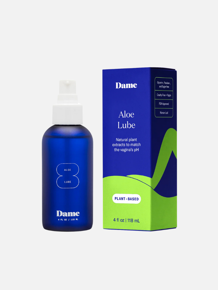 A blue bottle of Dame Aloe Lube next to its blue and green packaging. The label indicates it is plant-based and contains natural plant extracts for vaginal pH balance. Size: 4 fl oz (118 ml).
