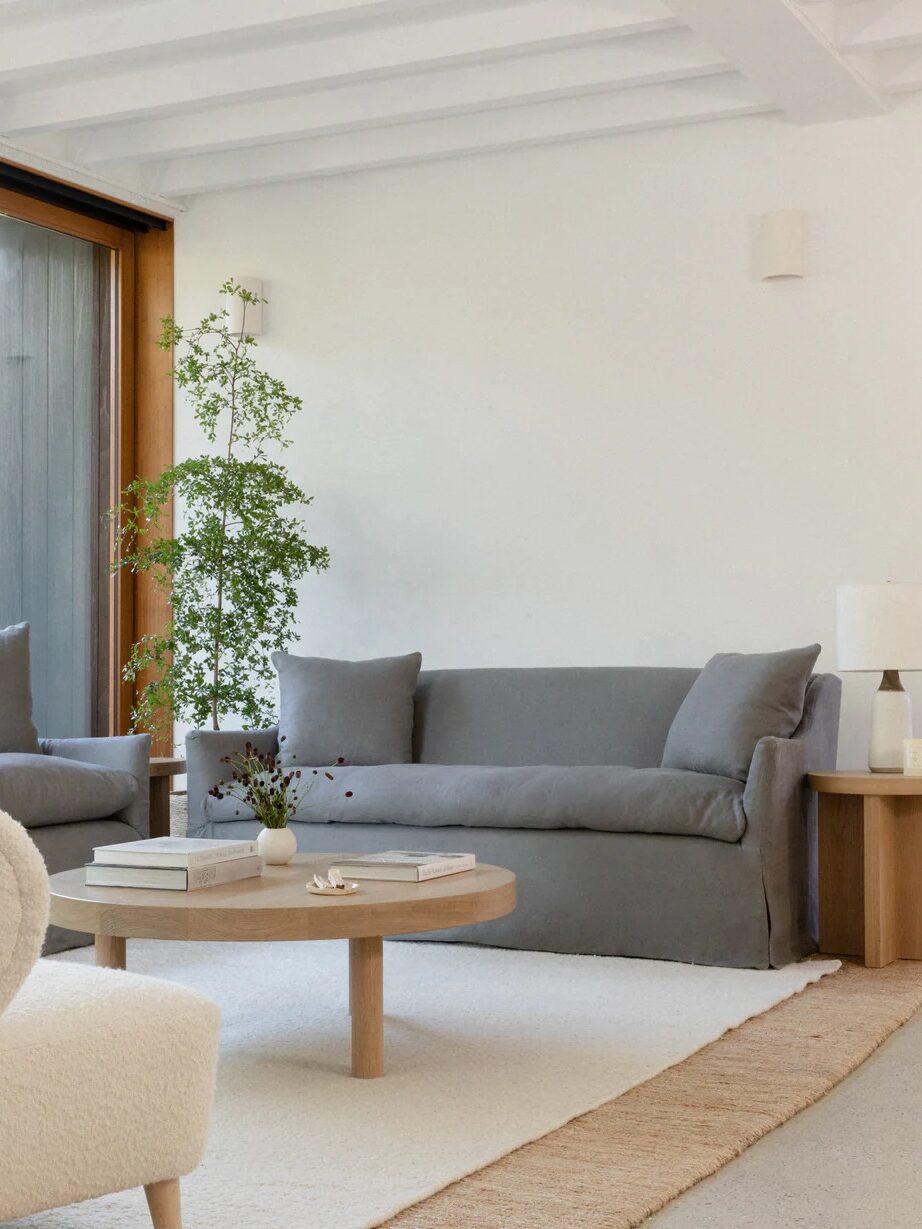 A grey Jenni Kane couch in a living room setting.