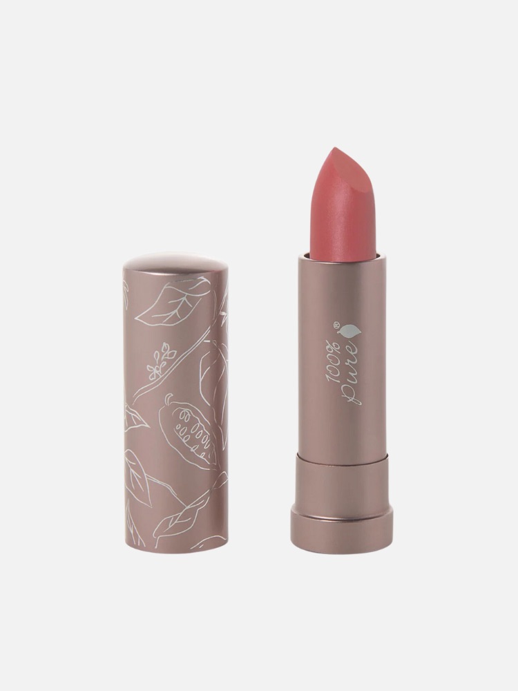 Pink lipstick in light brown tube with white floral illustrations. Tube reads "100% Pure." Cap positioned beside the lipstick. Light background.