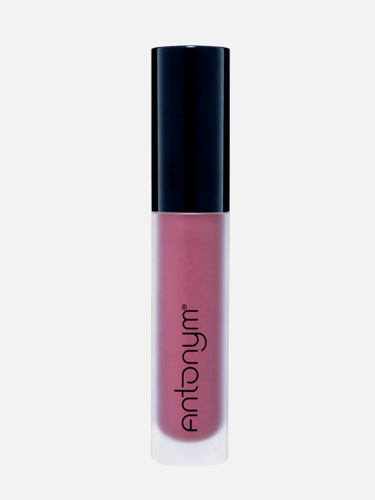 A cylindrical container of pink lip gloss with a black cap, labeled "Antonym" in black text on the front.