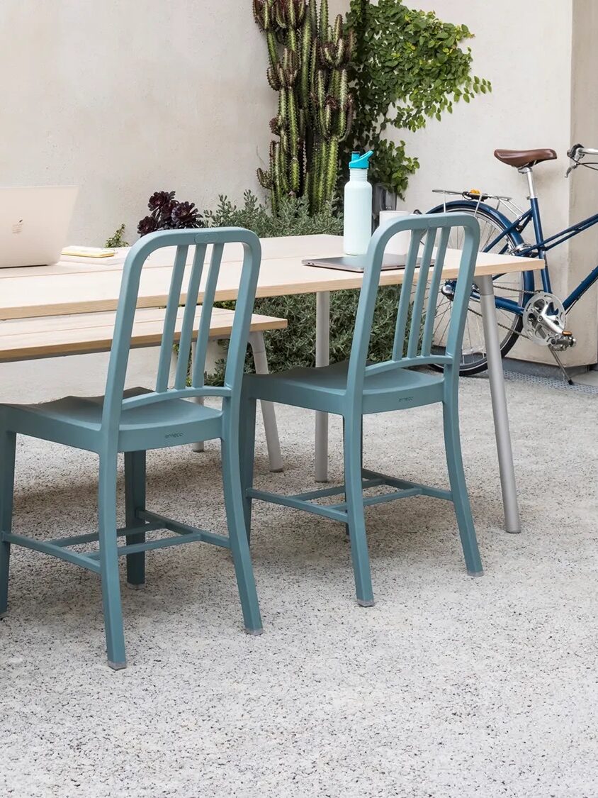 An outdoor table set with chairs from Emeco. 