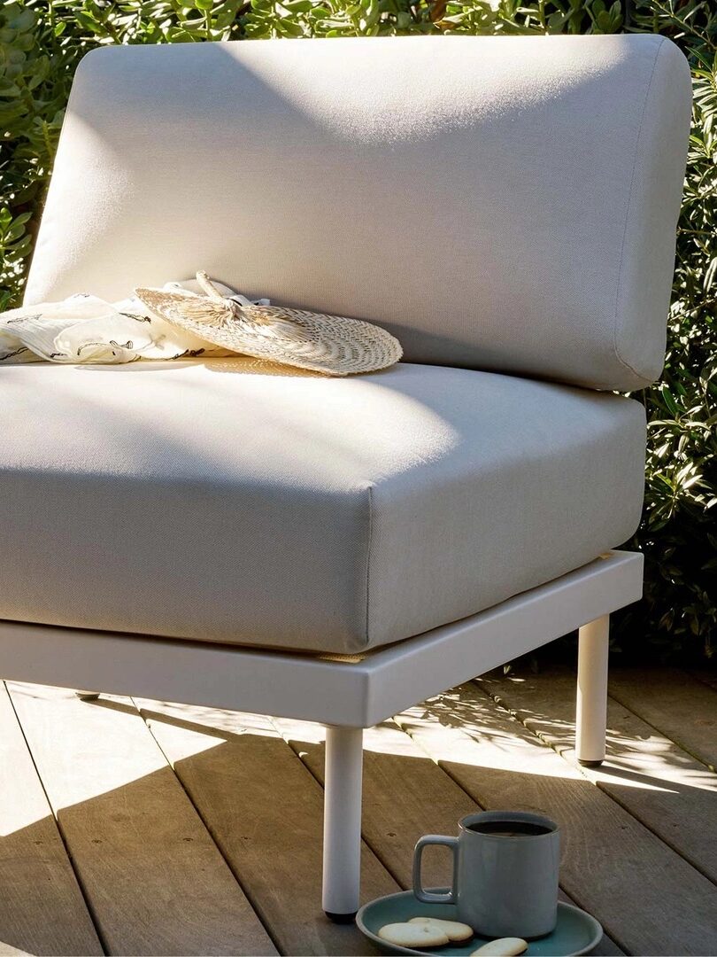 A white outdoor chair from Burrow.