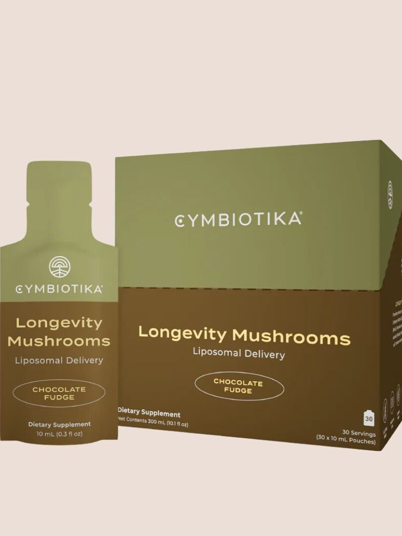 Product packaging showing a bottle and a box of Cymbiotika Longevity Mushrooms, a dietary supplement with liposomal delivery, chocolate fudge flavor, containing 30 servings.