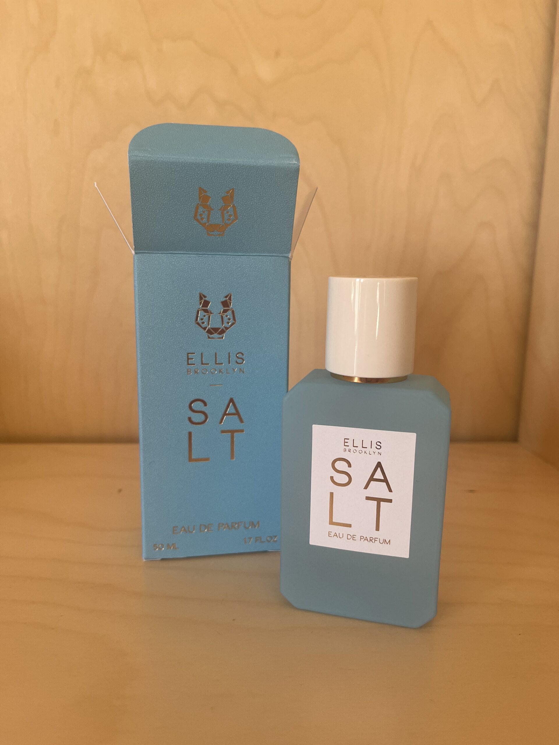 A bottle and box of Ellis Brooklyn Salt Eau de Parfum, featuring a minimalist design with a light blue and white color scheme.