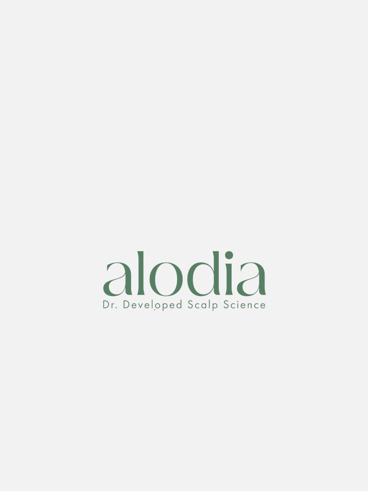 A logo with the text "alodia" in green, followed by "Dr. Developed Scalp Science" underneath in smaller green font on a white background.