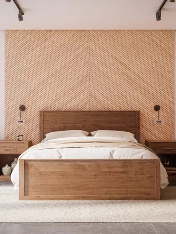 A modern bedroom with a wooden bed, two matching bedside tables, dressers, and a light wood accent wall. The room includes minimalist decorations and a neutral color palette.