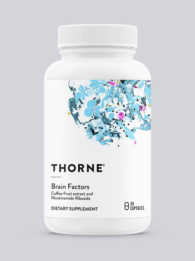 A white bottle labeled "Thorne Brain Factors" containing 30 capsules. The label mentions ingredients like Coffee Fruit extract and Nicotinamide Riboside. The bottle has an abstract blue and white design.