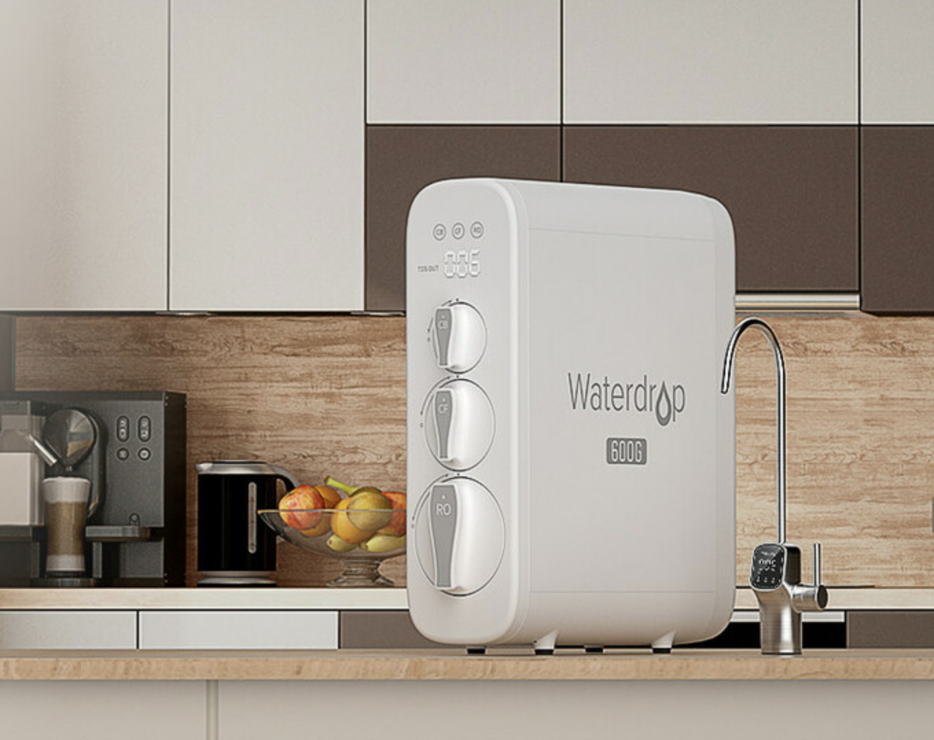 A Waterdrop G3 reverse osmosis water filtration system is installed on a kitchen countertop, with a fruit bowl, coffee machine, and faucet visible in the background.