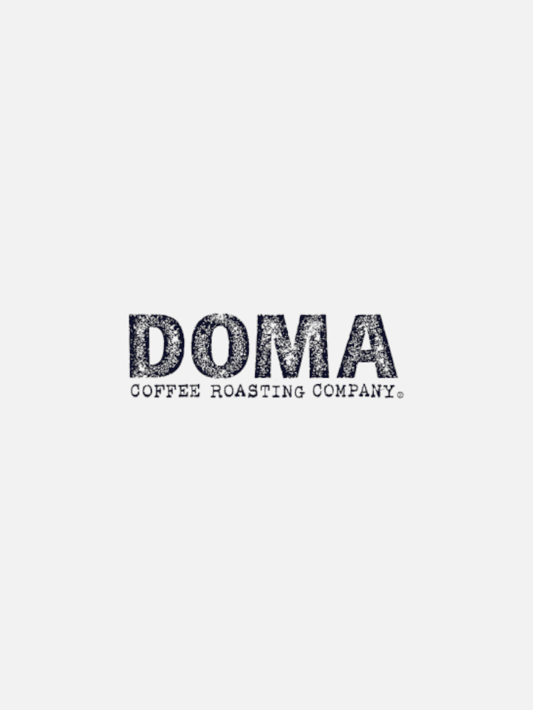 Logo of DOMA Coffee Roasting Company on a white background. The text "DOMA COFFEE ROASTING COMPANY" is displayed in a bold, distressed font.