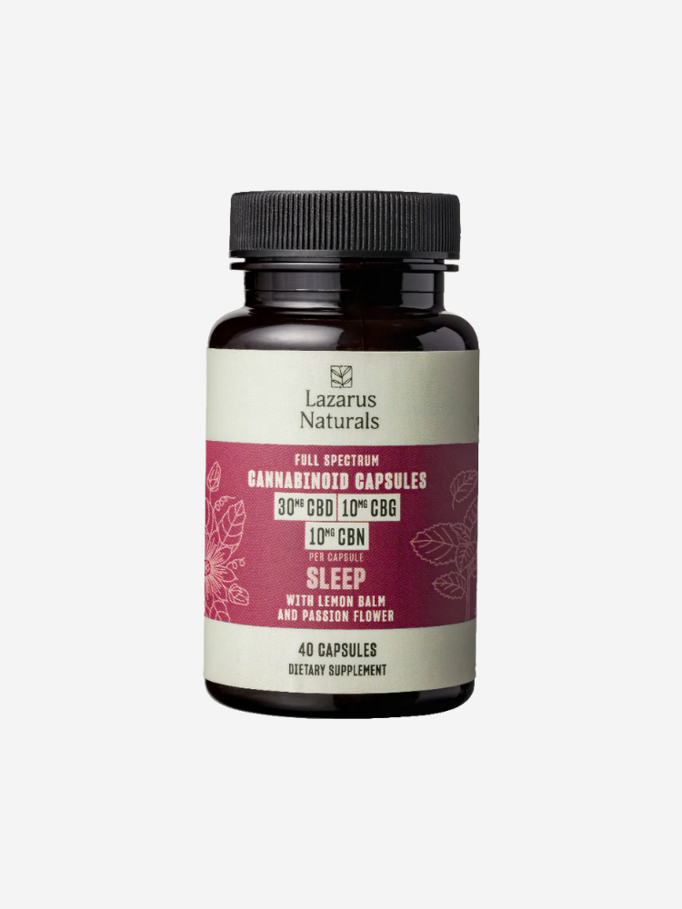 A bottle of Lazarus Naturals full spectrum cannabinoid capsules containing 30 mg CBD, 10 mg CBG, and 10 mg CBN per capsule. The label indicates it promotes sleep and contains lemon balm and passion flower.