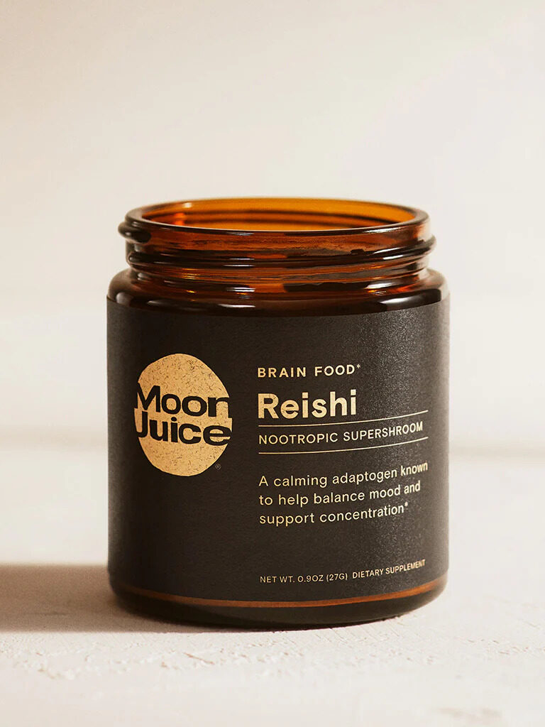 A dark amber jar labeled "Moon Juice Reishi," described as a nootropic supershroom for balancing mood and concentration.