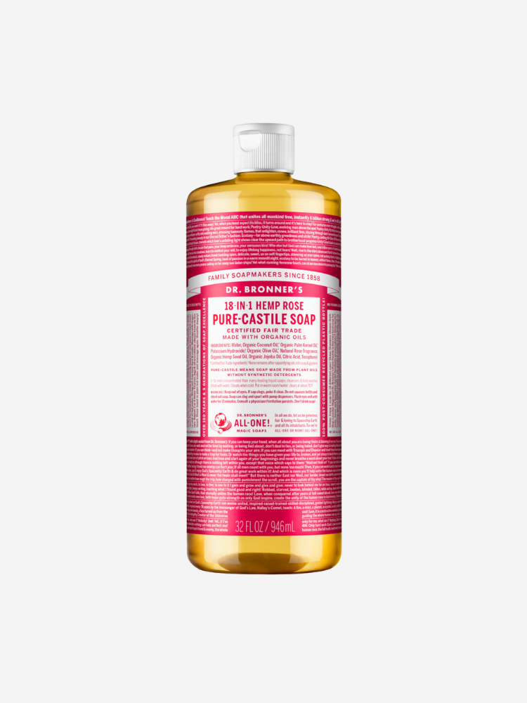 A bottle of Dr. Bronner's 18-in-1 Hemp Rose Pure-Castile Soap, 32 FL OZ/946 ML. The bottle features a red label with white and black text detailing the product's ingredients and uses.