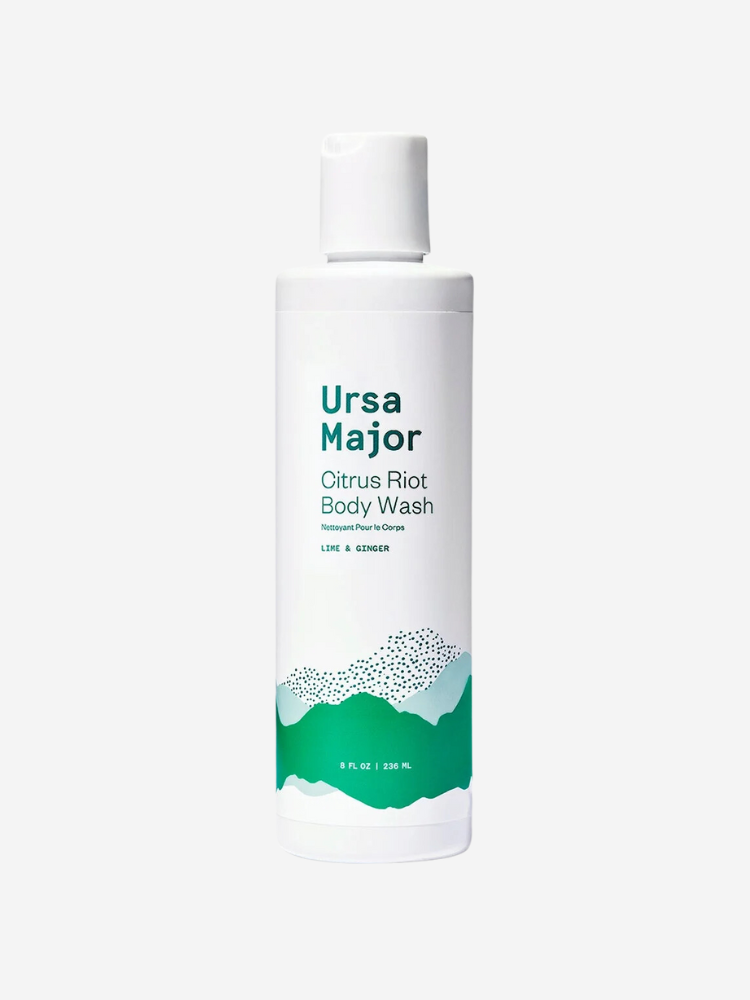 A white bottle of Ursa Major Citrus Riot Body Wash with green accents, containing 8 fl oz (236 ml). The label mentions "Natural Firm Foam" and "Lime & Ginger".