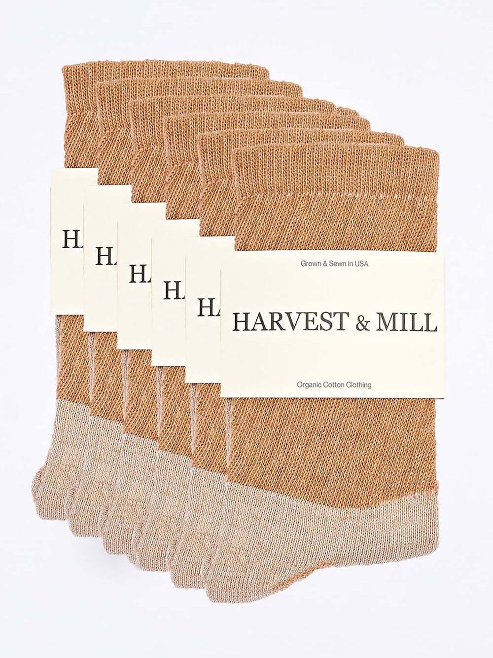 A pack of five pairs of organic socks labeled "Harvest & Mill Organic Cotton Clothing." The brown socks have a speckled pattern and are displayed against a white background.