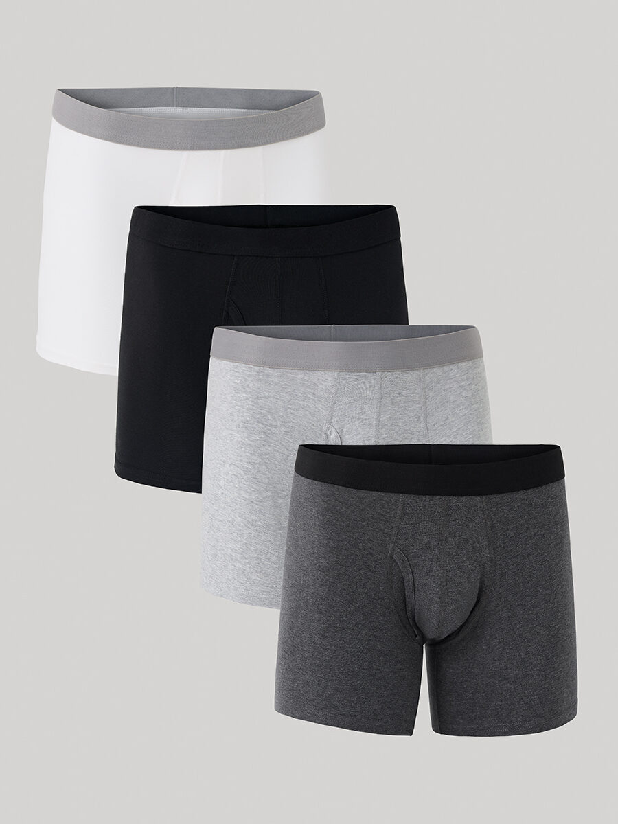 Four pairs of men's boxer briefs in white, black, light grey, and dark grey, displayed in a staggered arrangement against a plain background.