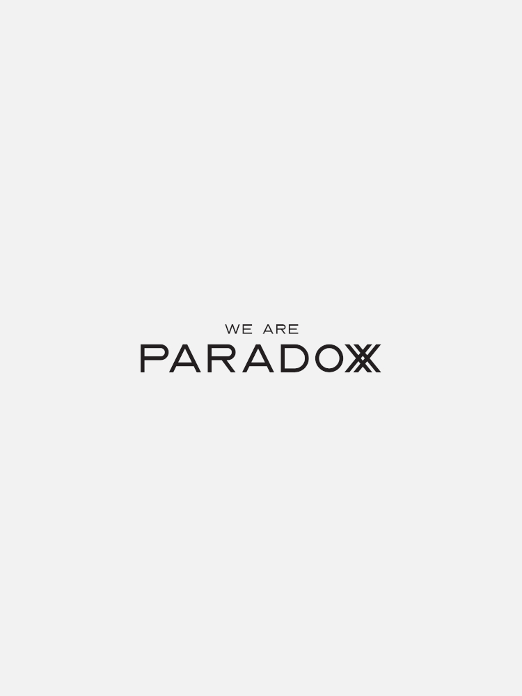 Text reads, "WE ARE PARADOXX" in bold black letters on a plain white background.