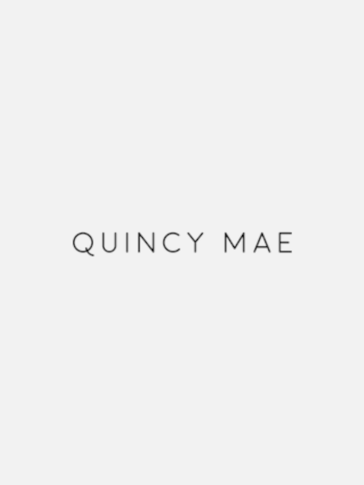 Text reading "QUINCY MAE" in simple, black font centered on a white background.