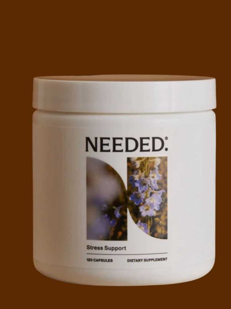 A white container labeled "NEEDED." with an image of flowers on the front. The label indicates it is a dietary supplement for stress support, containing 120 capsules.