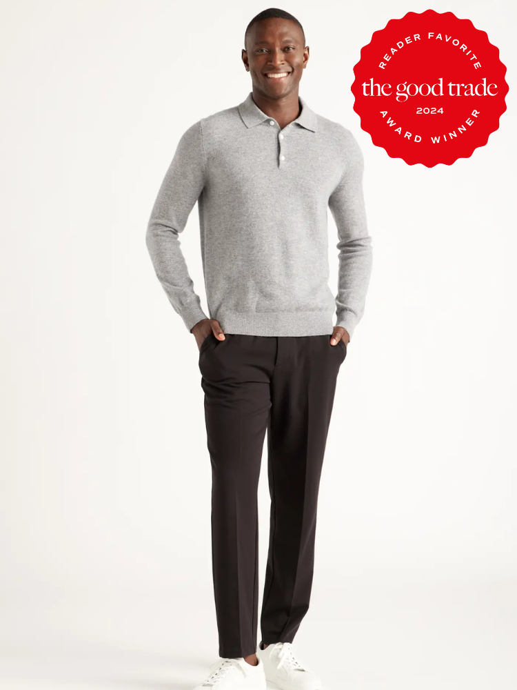 A model wearing a grey polo long sleeve cashmere sweater from Quince. 