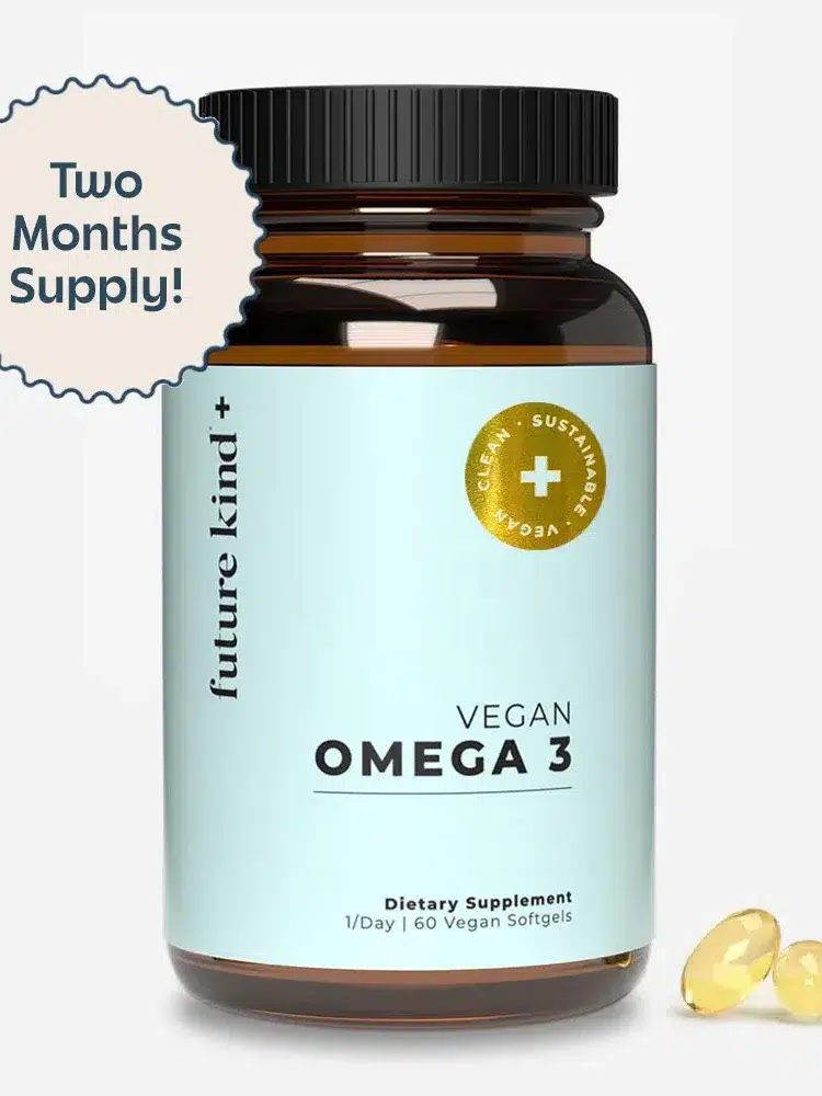 A bottle of Future Kind Vegan Omega 3 dietary supplement with 60 softgels and a label indicating a two-month supply. Two yellow softgel capsules are placed beside the bottle.