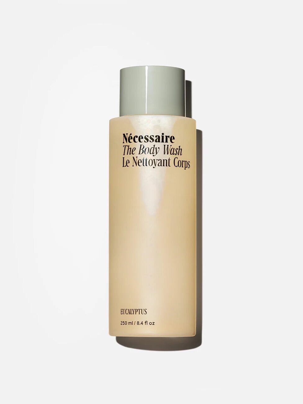 A bottle of Nécessaire The Body Wash in Eucalyptus scent, with 250 ml/8.4 fl oz of product, against a white background.