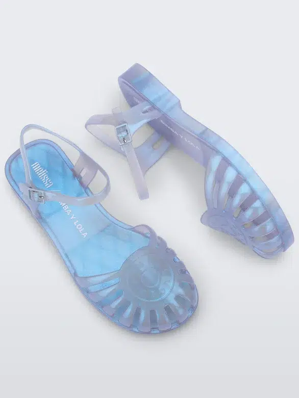 A pair of translucent blue jelly sandals with adjustable ankle straps.