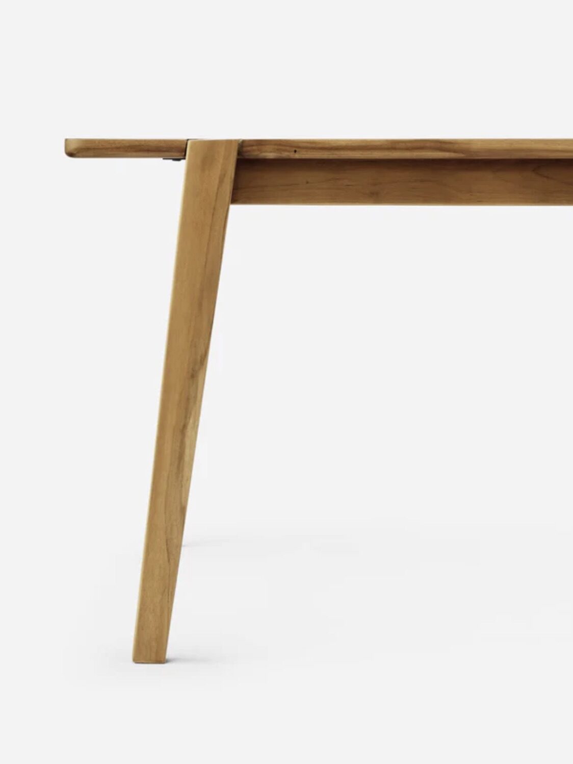 Side view of a wooden table leg and corner with clean lines and a minimalist design against a plain white background.