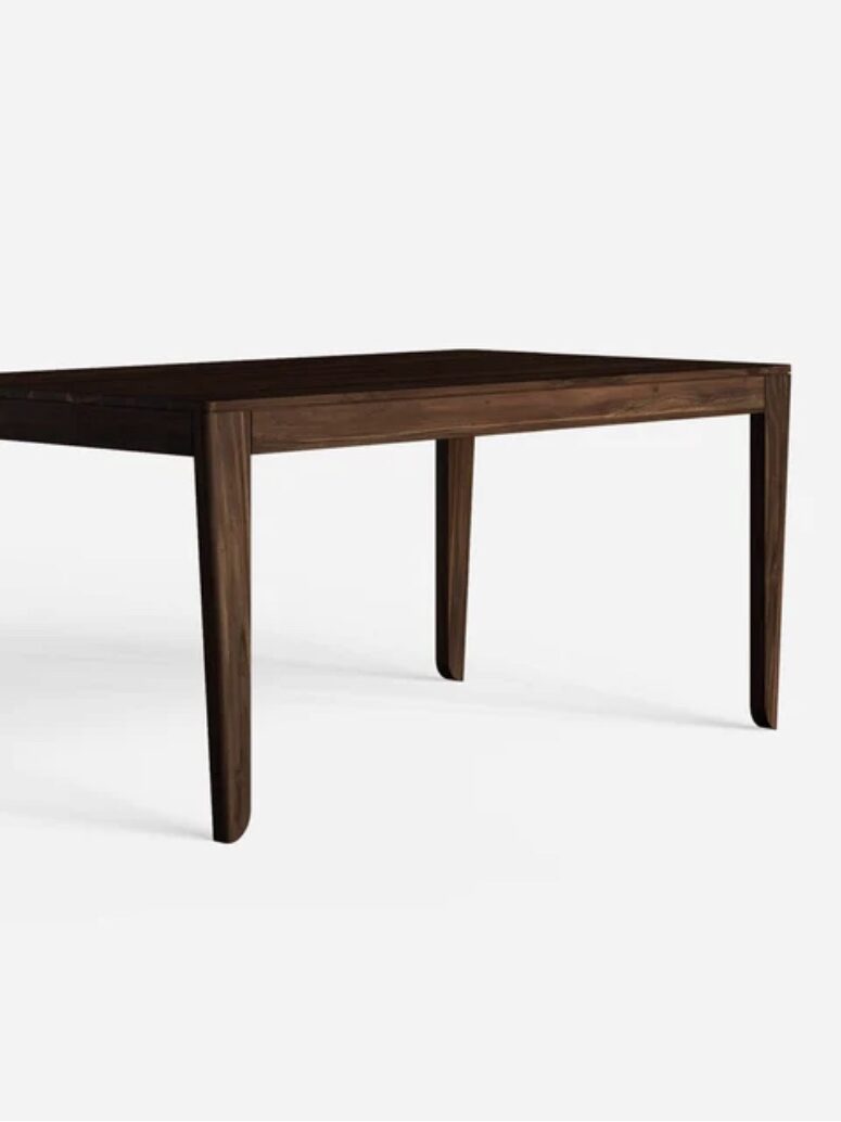 A dark wooden rectangular dining table with tapered legs against a plain white background.