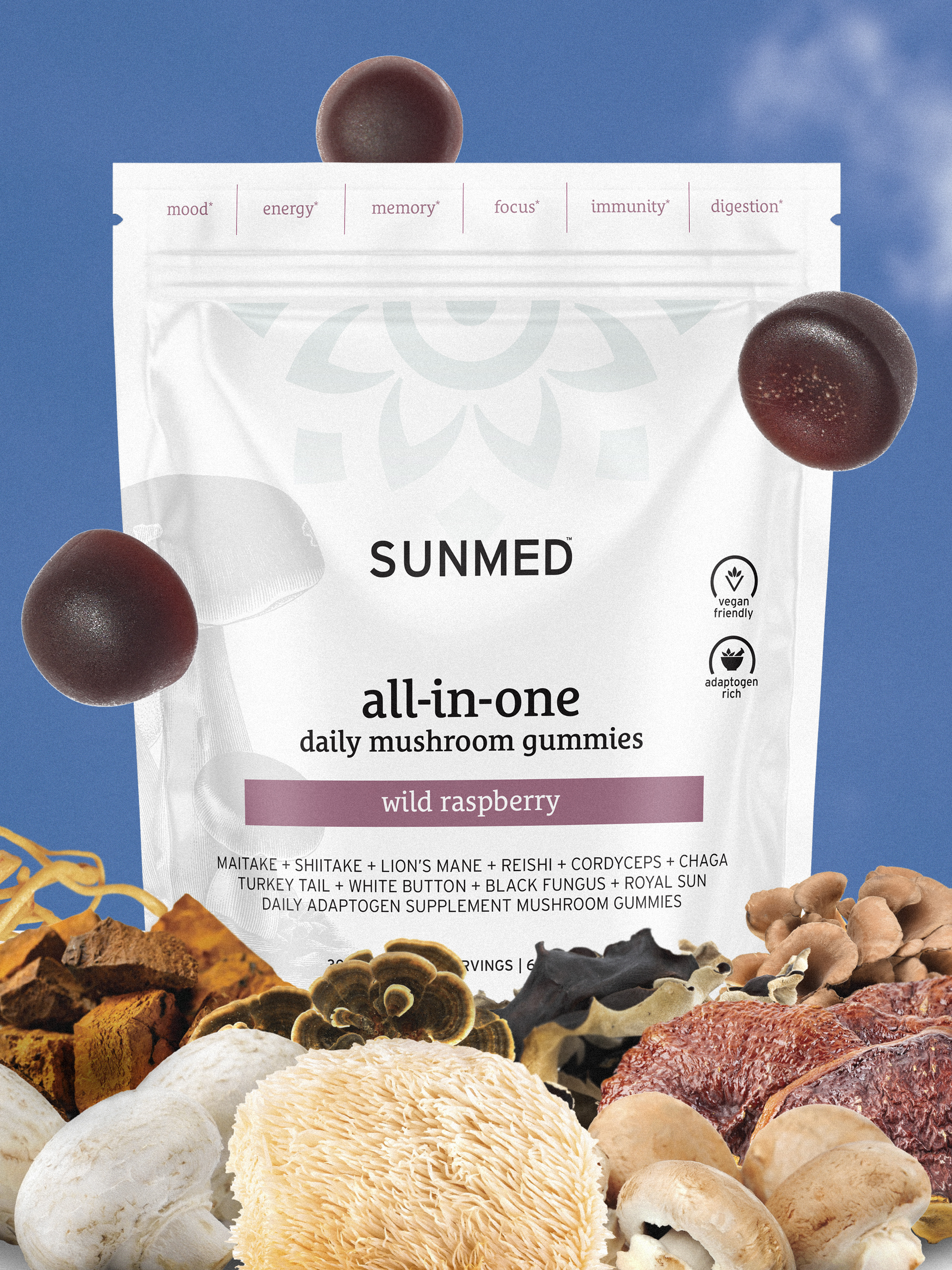 A packet of Sunmed all-in-one daily mushroom gummies, wild raspberry flavor, surrounded by various mushrooms and other natural ingredients against a blue sky background.