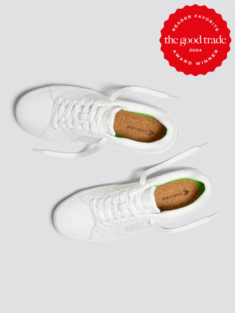 A pair of white Cariuma shoes. 