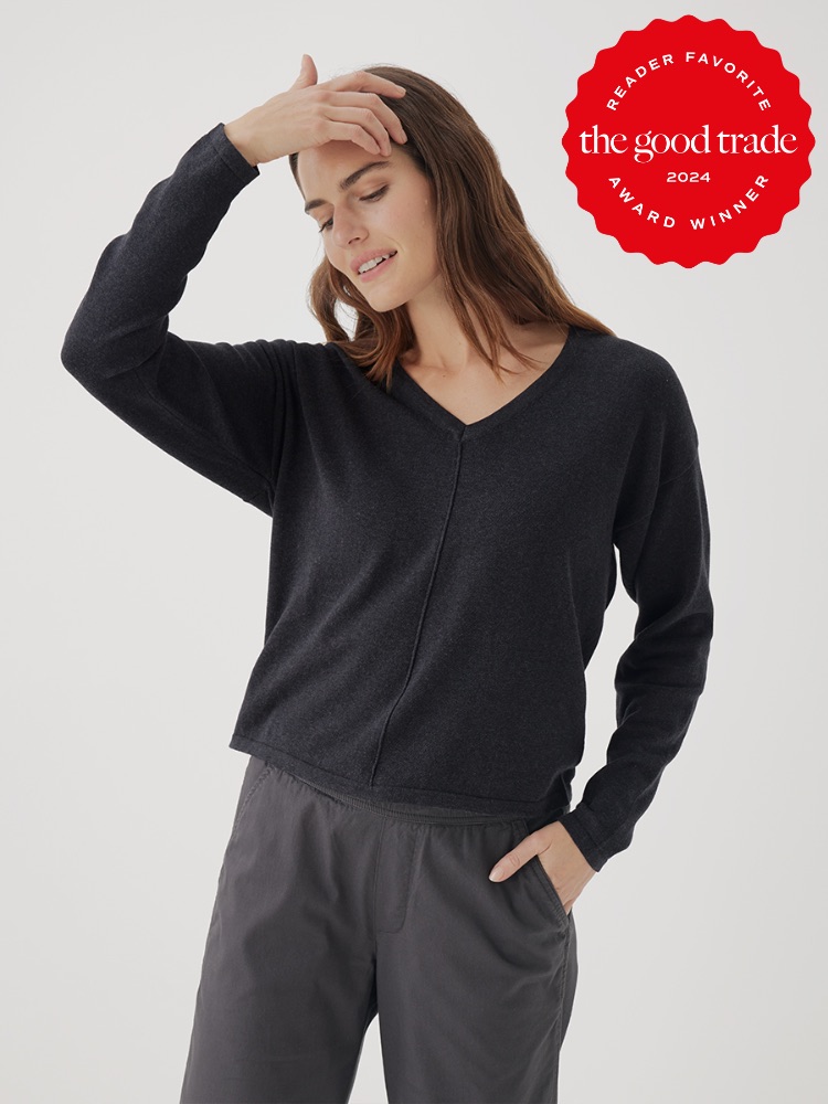 A person wearing a black long-sleeve top and grey pants is touching their head with one hand. A red badge on the image reads "Reader Favorite - The Good Trade Award Winner 2024.