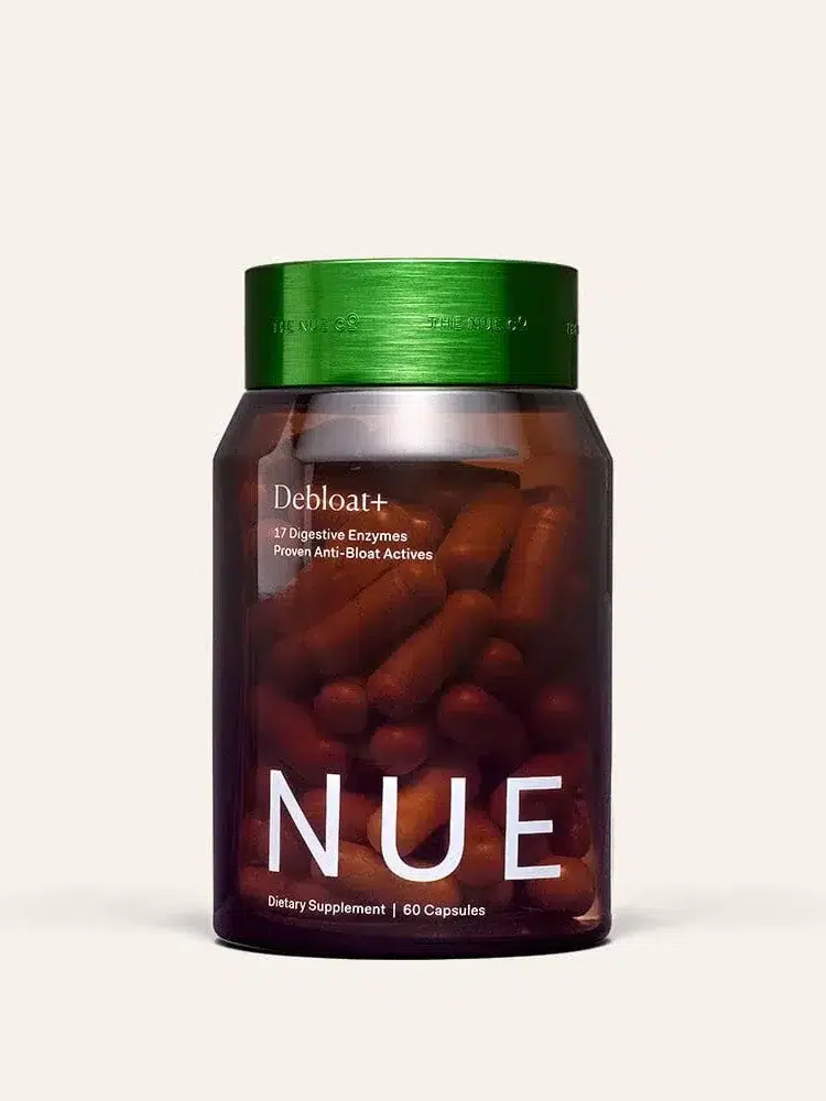 A brown bottle with a green cap labeled "Debloat++ NUE" containing 60 capsules of a dietary supplement.