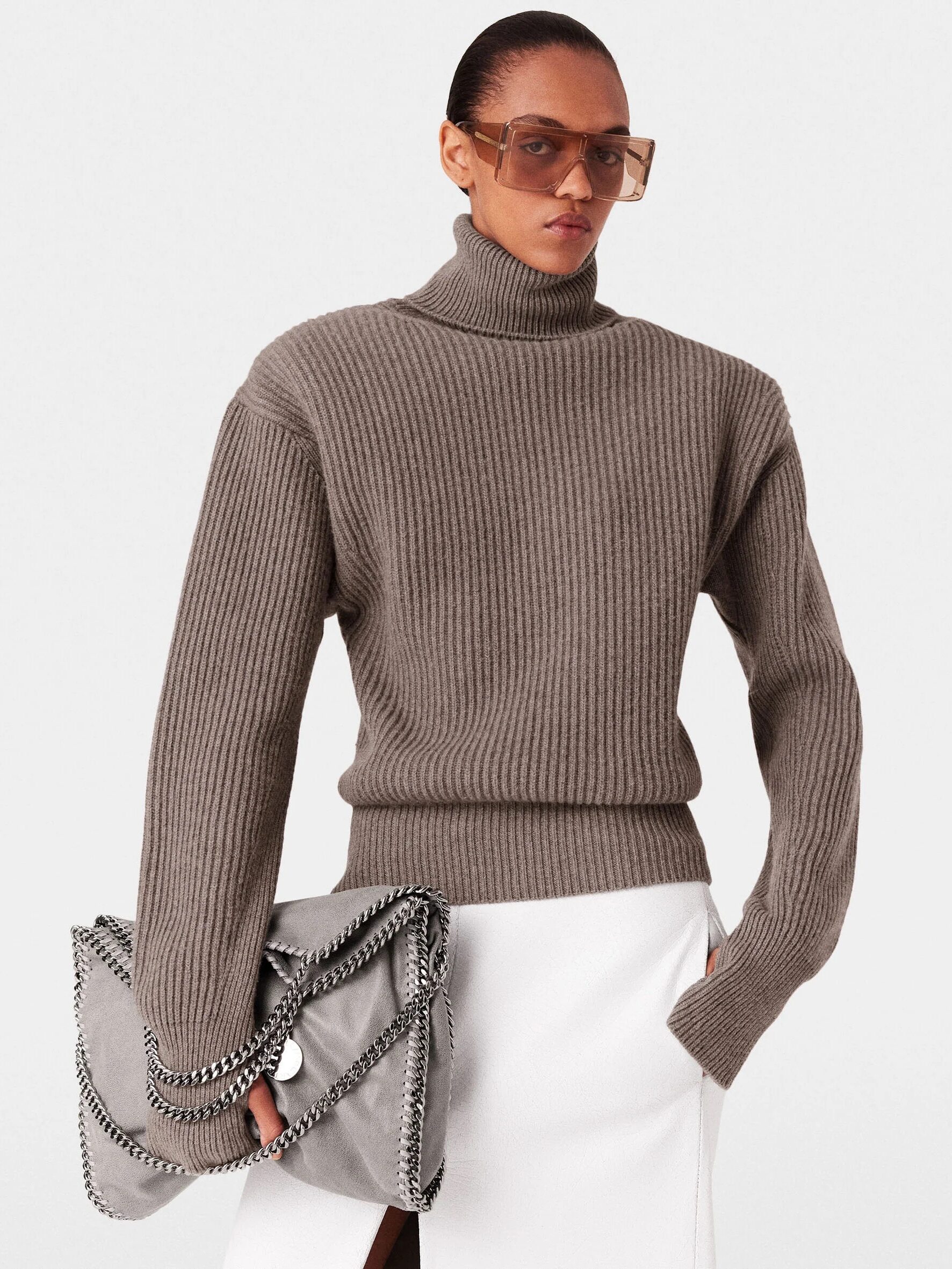 A model wearing a taupe cashmere turtleneck from Stella McCartney. 