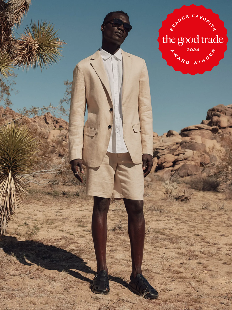 Man stands outdoors in a beige suit with shorts and a white shirt, wearing sunglasses. "Reader Favorite, the good trade, 2024 Award Winner" badge is displayed in the top right on a red seal.