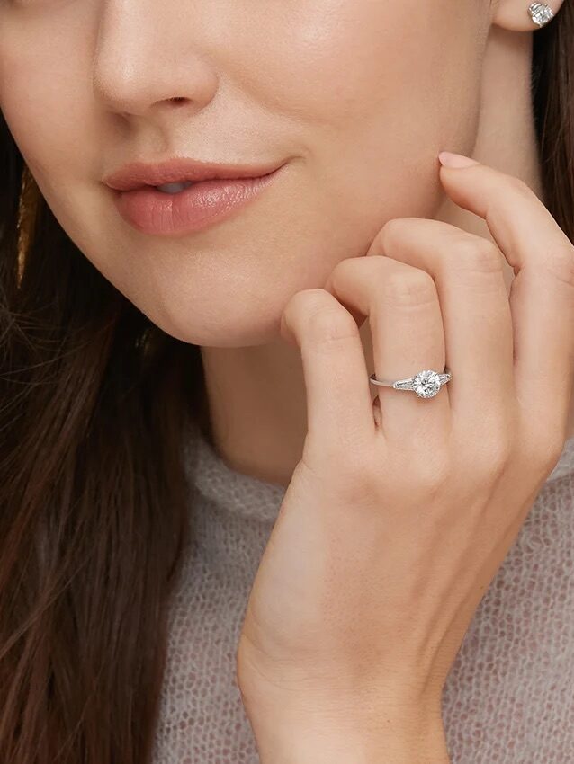 A model wearing a Brilliant Earth engagement ring.