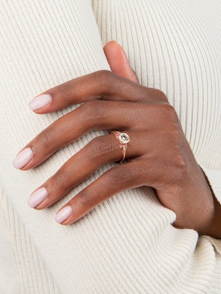 A model wearing a Brilliant Earth engagement ring.