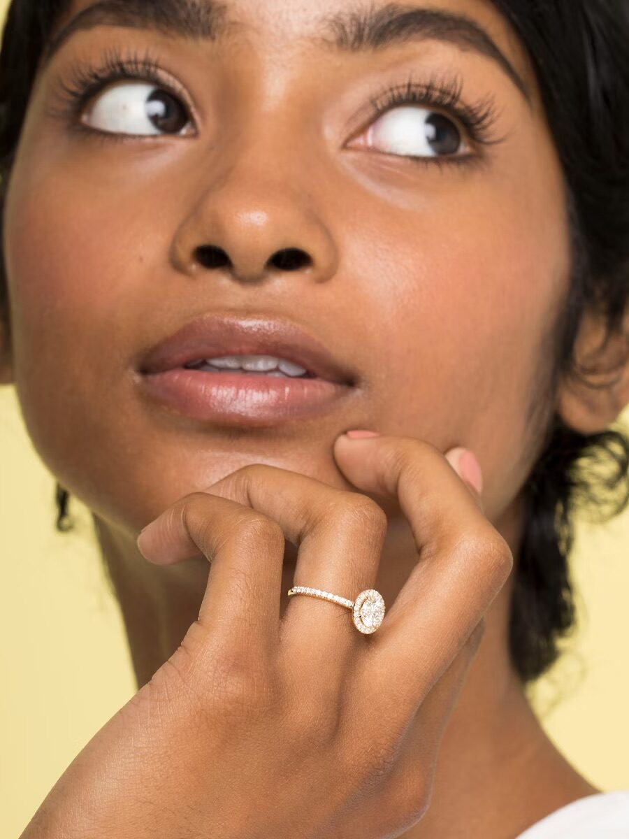 A model wearing a Vrai engagement ring.