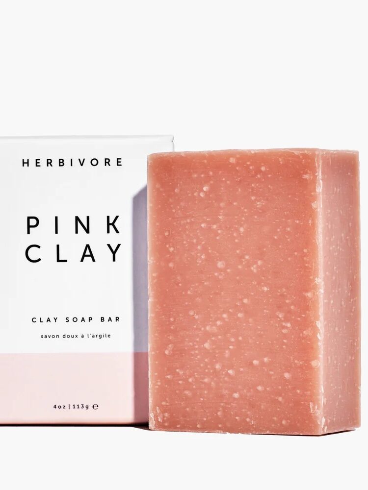 A bar of Herbivore Botanicals bar soap next to its packaging. 