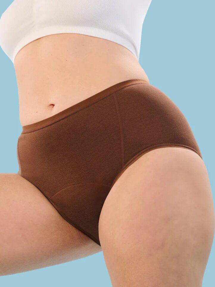 A model wearing brown Period Aisle underwear. 