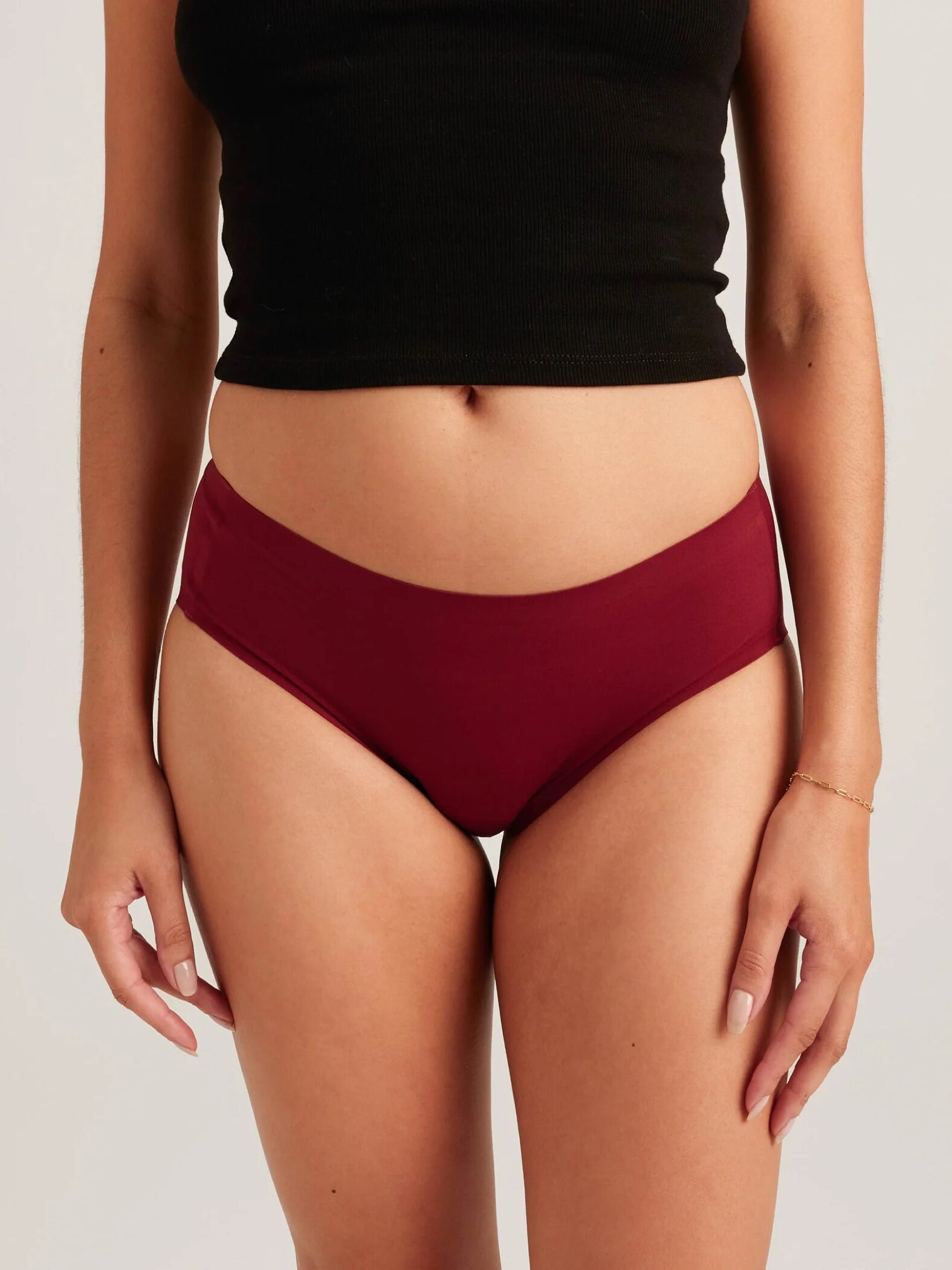 A model wearing Saalt period underwear in crimson. 