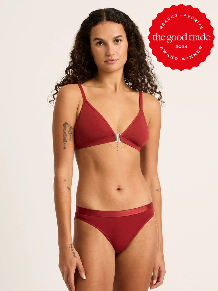 A model wearing a matching red intimates set from Boody. 