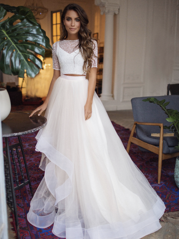 A model wearing a wedding dress from Borrowing Magnolia.