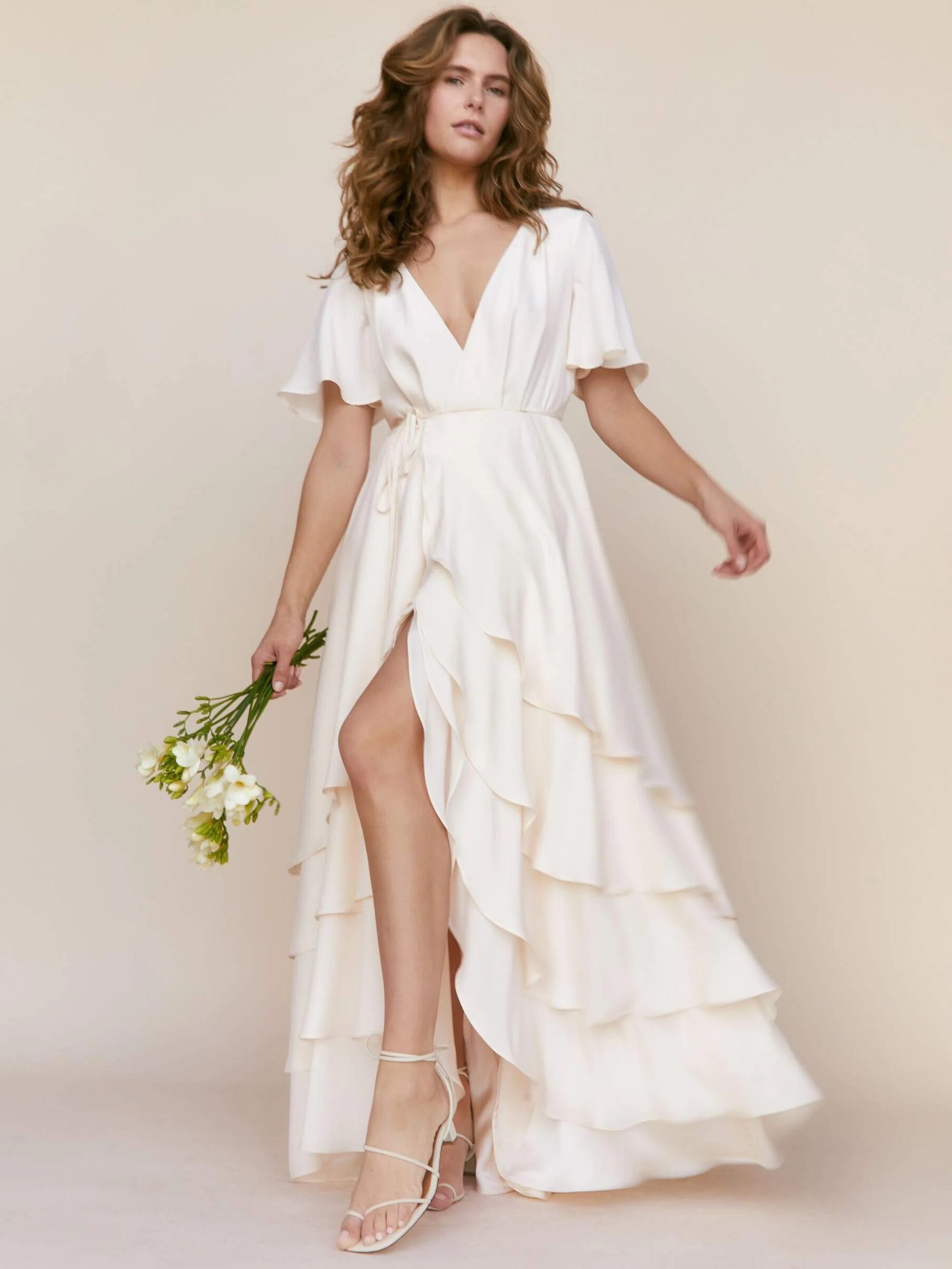 A model wearing a wedding dress from Christy Dawn.