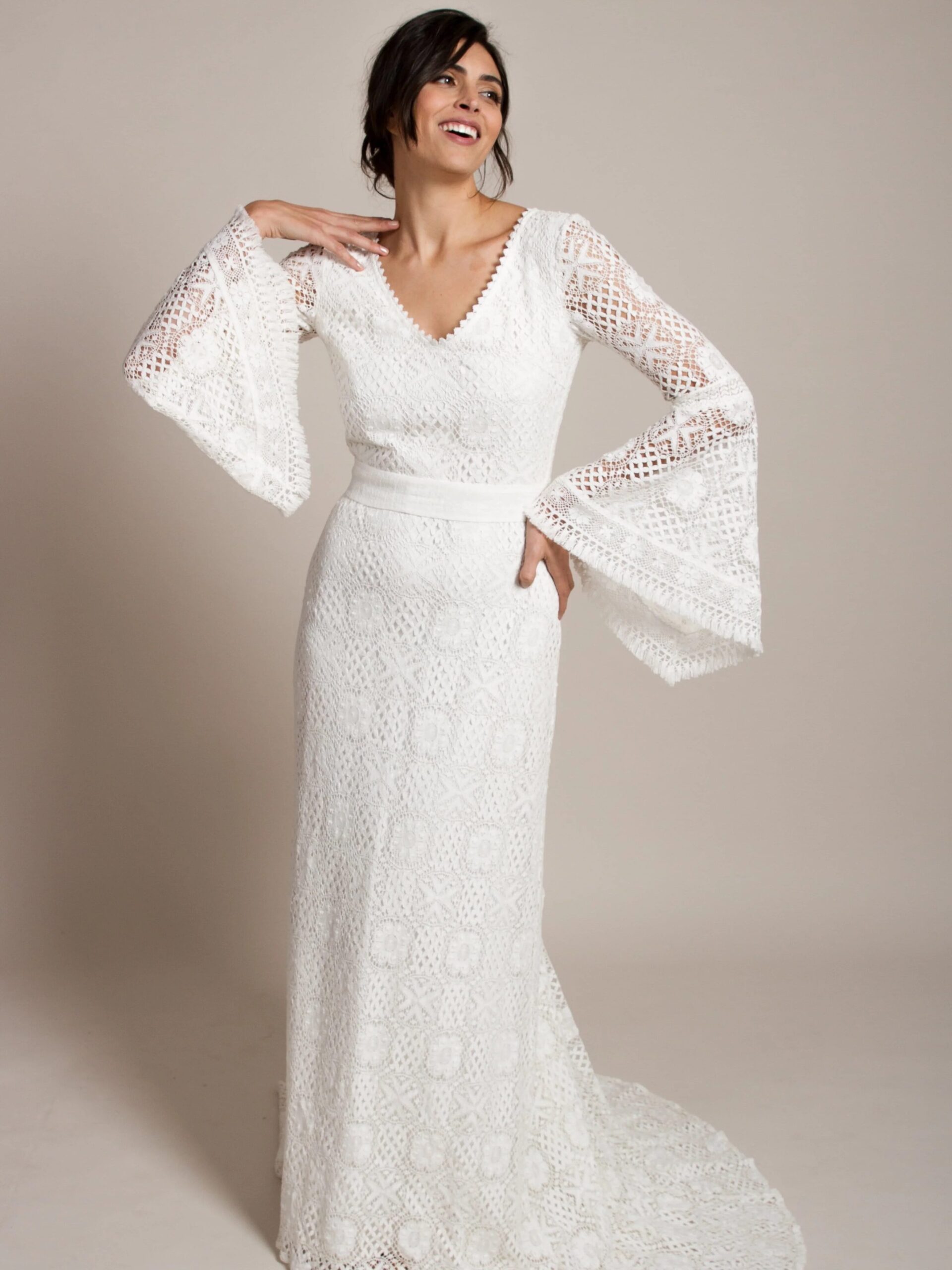 A model wearing a wedding dress from Indiebride.