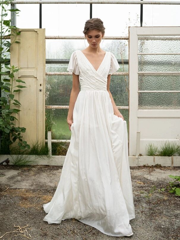 A model wearing a Leila Hafzi wedding dress.